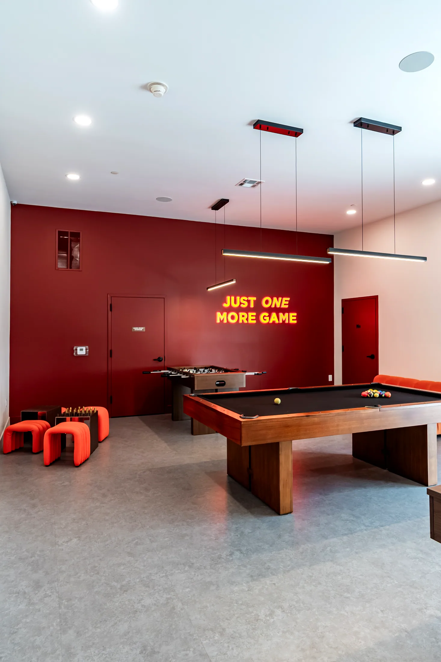 Game room with the neon sign over the pool table