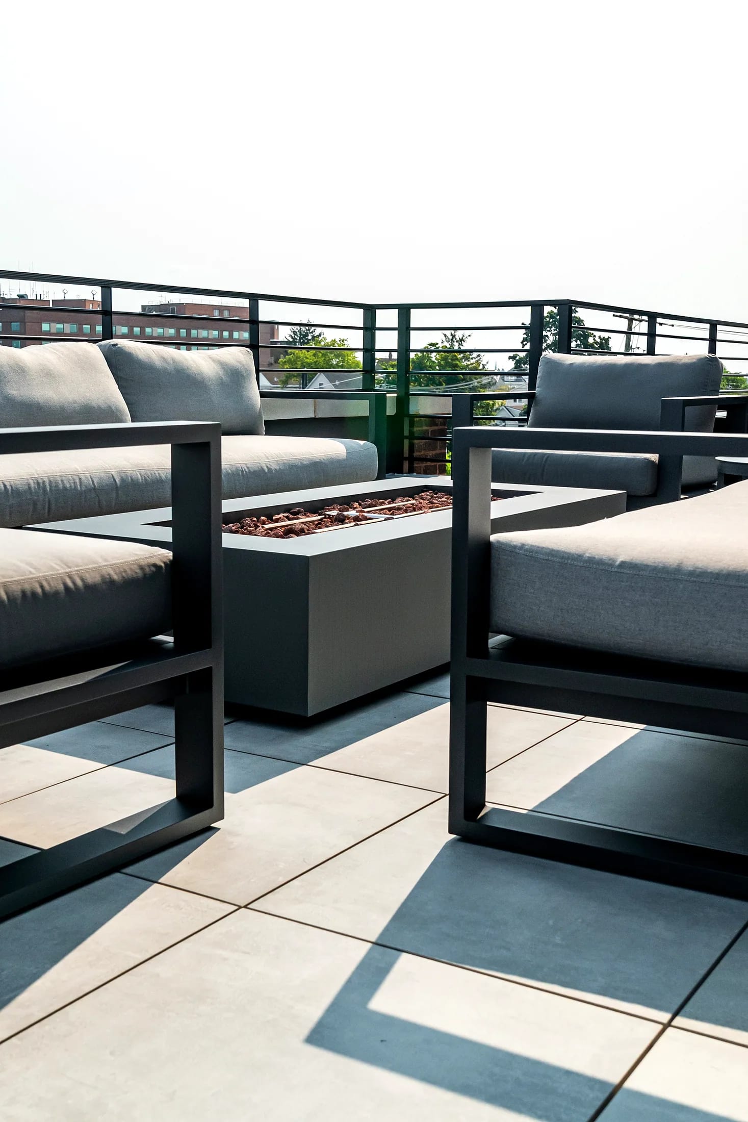 Firepit with lounge seating on the roof terrace at Five85West